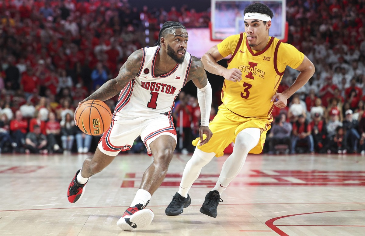Houston Cougars guard Jamal Shead (1) drives with the ball as Iowa State Cyclones guard Tamin Lipsey (3) defends during the second half at Fertitta Center. 